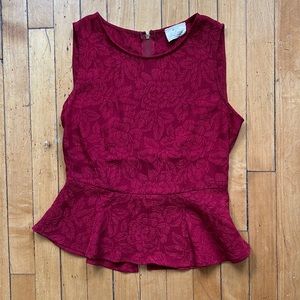 Red peplum top, gently worn.